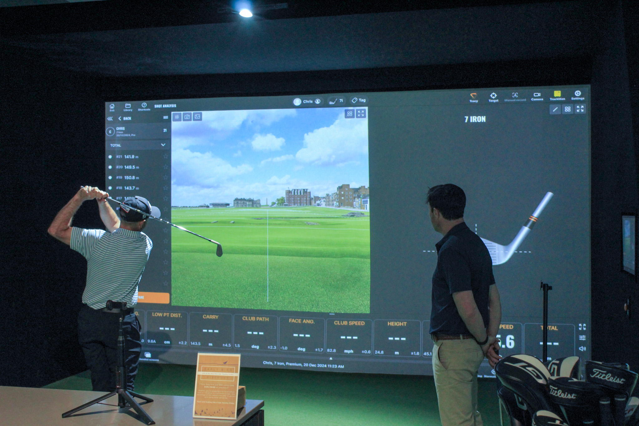Man playing indoor golf on a TrackMan Golf Simulator at Howe2Golf